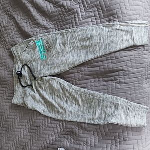 PINK sweat pants with zippered ankle.